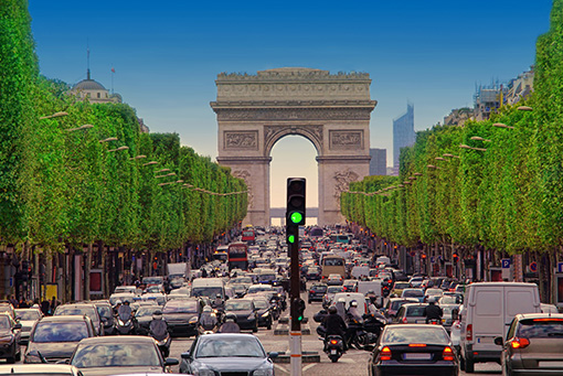 Navigating Traffic in Paris With View of Arc de Triomphe and Champs-Elysées Boulevard
